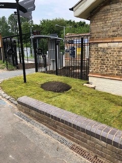 new turf at front of station